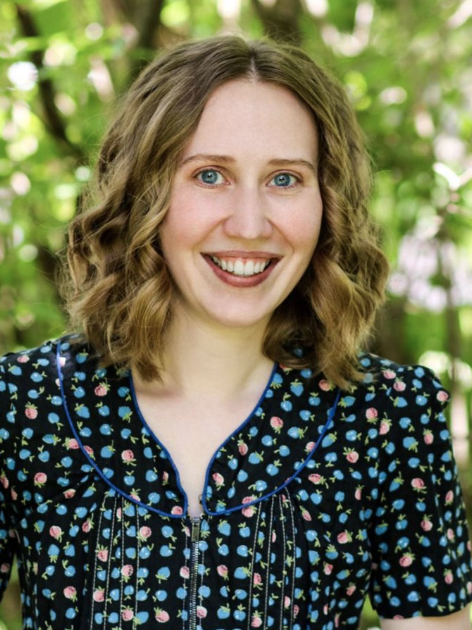 a picture of a woman smiling at the camera