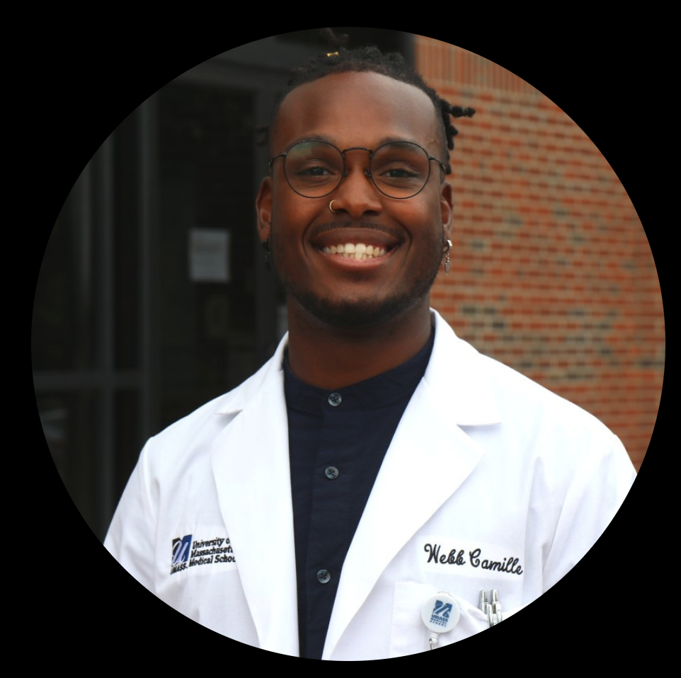 A picture of a man in a white coat smiling