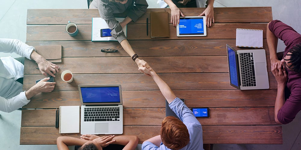 Group of People Meeting at Table