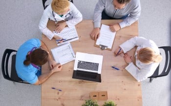  Male-and-female-doctors-working-small.jpg