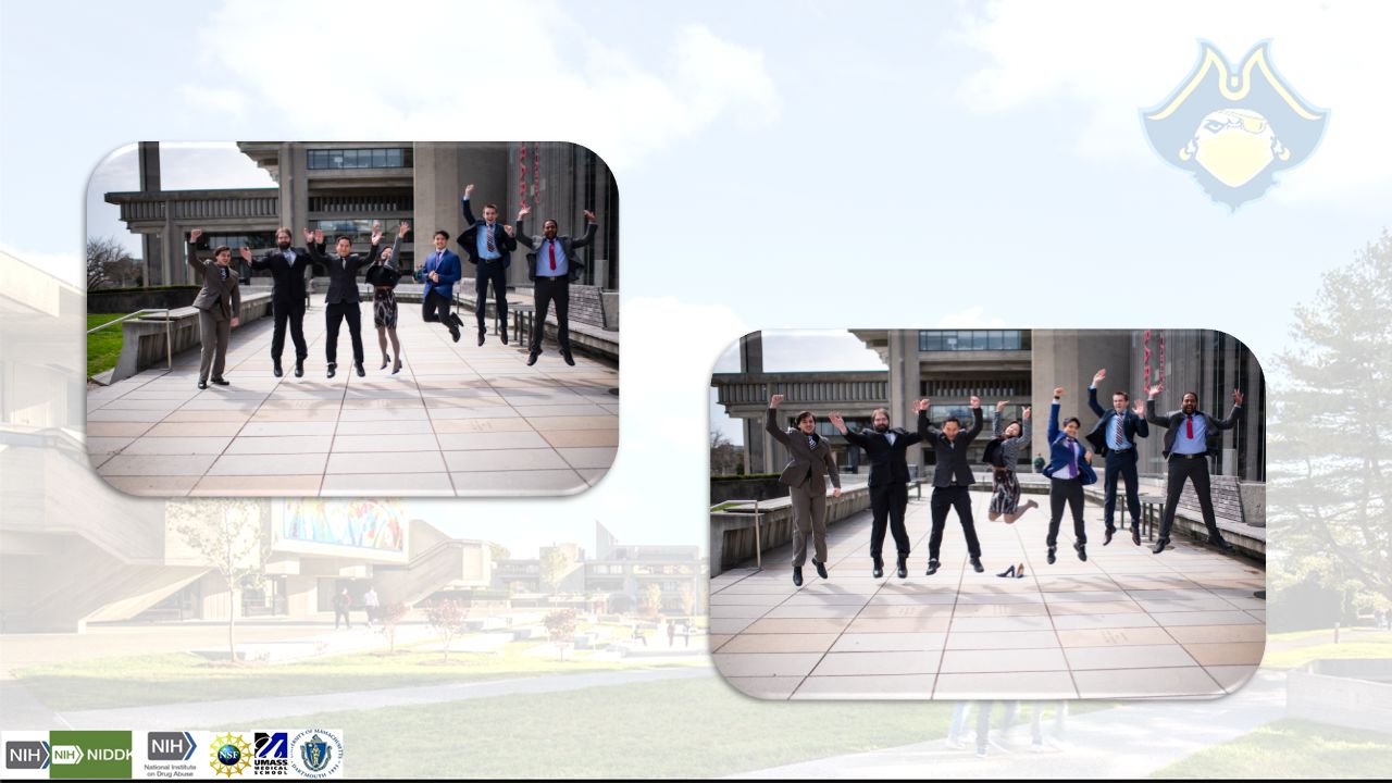 Lab members posing and jumping up in front of Government Center, Boston