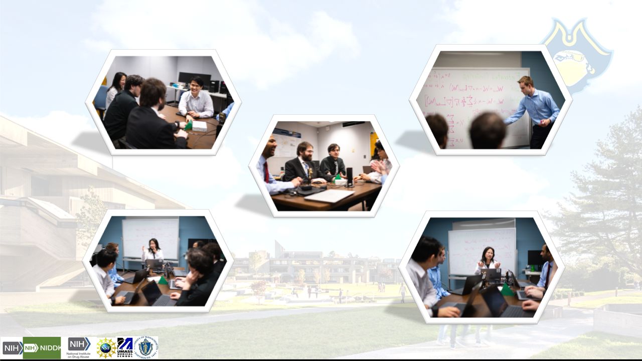 Lab members sitting around a conference table within the office