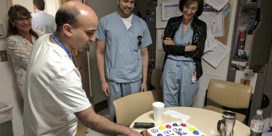 GI physicians celebrating with cake