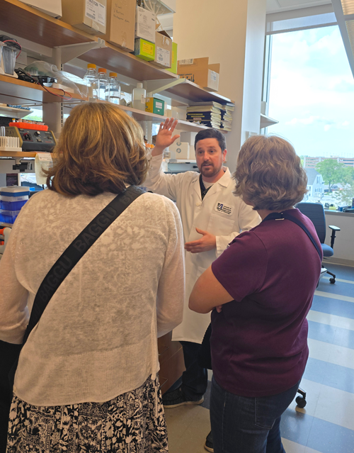 Lab tour guests speaking with Nick Wightman, Manager of Research Operations in Brown Lab