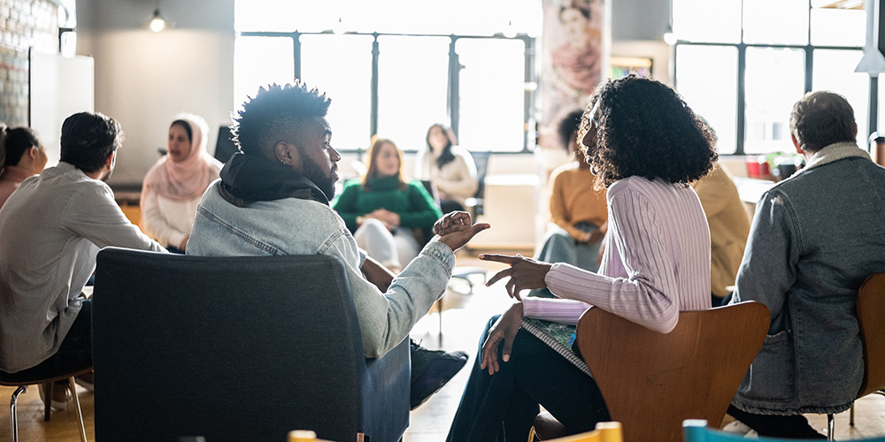 group of diverse teens in a group meeting