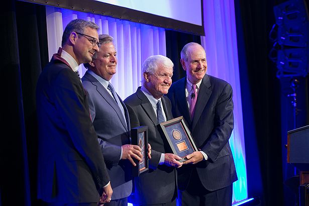 Job Dekker (left) and Chancellor Collins recognize Sam and Joseph Byrne for endowing the Joseph J. Byrne Chair in Biomedical Research.