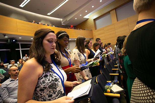 Students recite the nursing pledge.