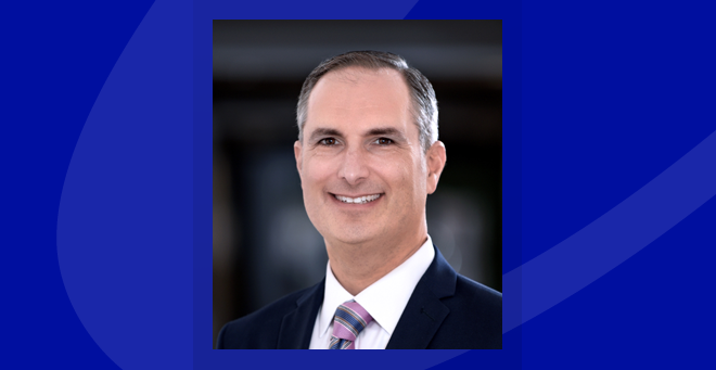 Lee Leiber headshot on a blue background