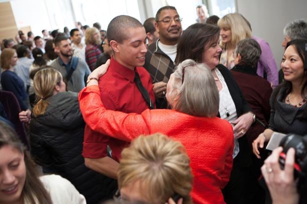 Michael Richardson is congratulated by Senior Associate Dean Michele Pugnaire on his family medicine match at Boston’s Steward Carney Hospital.