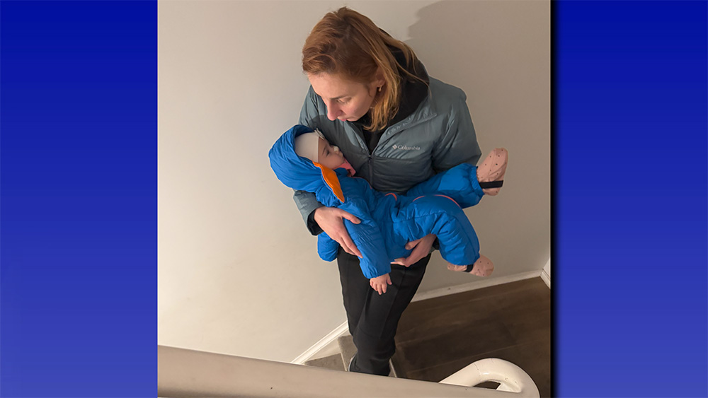 Tamara Radivilova holds her daughter, Catherine, in Brussels