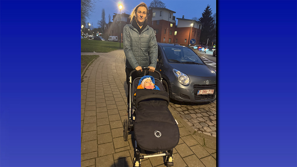 Tamara Radivilova takes her daughter, Catherine, for a walk outside.