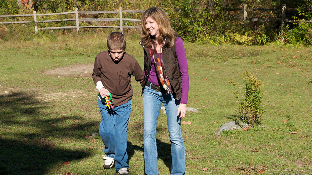 Jennifer Siedman walks outside with her son, Ben