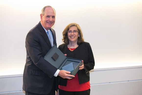 Chancellor Michael Collins and Celia A. Schiffer, PhD, recipient of the Chancellor’s Award for Excellence in Mentoring