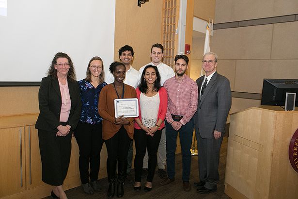 “Young Men of Today: Medical Professionals of Tomorrow” MLK Semester of Service Award winners stand with Dr. Haley and Dean Flotte.