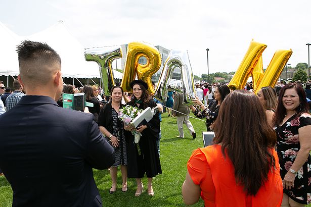 Meme Tran is congratulated after earning her MD.