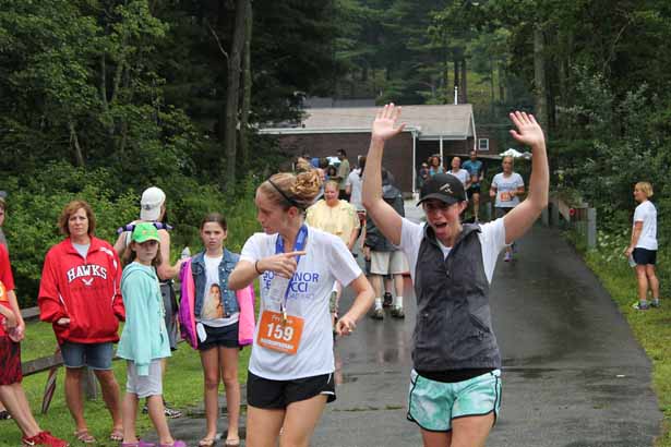 Frannie Weld, daughter of former Gov. William Weld, and Anne Adams, daughter of the late Gov. Paul Cellucci, are jubilant at the finish.