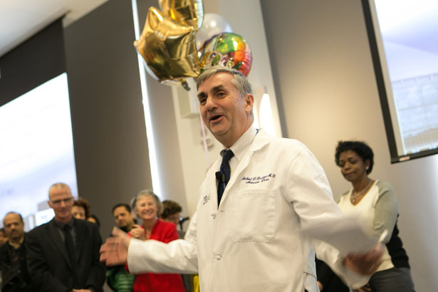 Interim Associate Dean of Student Affairs Michael Kneeland, MD, begins distributing the envelopes containing residency destinations at Match Day 2015.