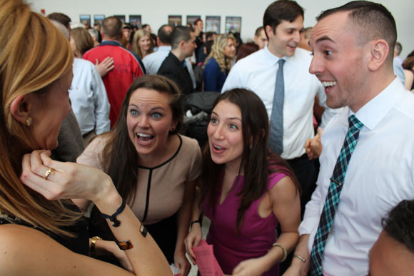 Classmates react to Kathryn Kennedy’s news that she’ll be going to Tulane. From left, Emily Coggins, Kaitlin Fitzpatrick and Malek Mazzawi, all of whom are going to Tufts.