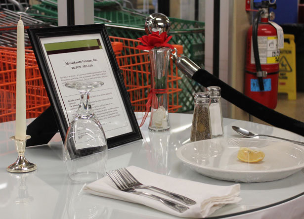 A table for one is set up symbolically at Veterans Inc. in memory of the members of the armed forces who never returned home.