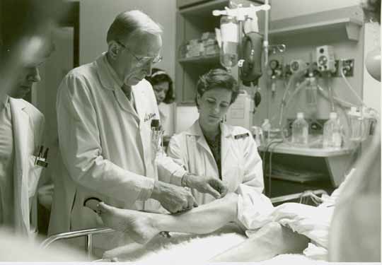 Dr. Wheeler with residents on the ward