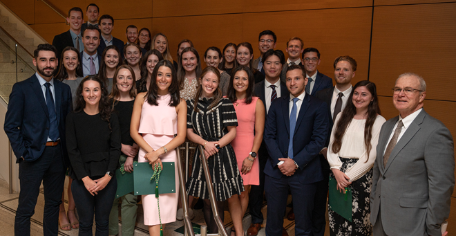 The 34 new student members of the Delta chapter of the Alpha Omega Alpha Honor Medical Society are joined by Terence Flotte, MD (far right).