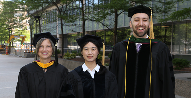 Melissa Brown, Han Zhang and Christian Keenan standing together outside