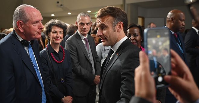 Chancellor Michael F. Collins with French President Emmanuel Macron at the WHO Academy’s opening ceremony