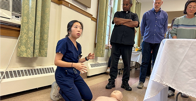 Jennifer Jaein Jung with a CPR manikin 