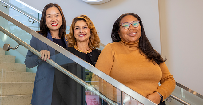 Melody L. Tran-Reina, Shadi Aminololama-Shakeri and Charlene Green on a staircase