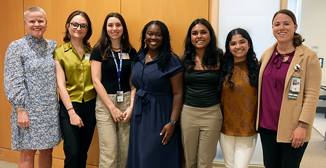 Kristin Mattocks Tesia Britt; Michaela Ayisi; Faith Marley; Akila Sanjay; and Sibapriya Marimuthu; and Lisa Shenette standing together  